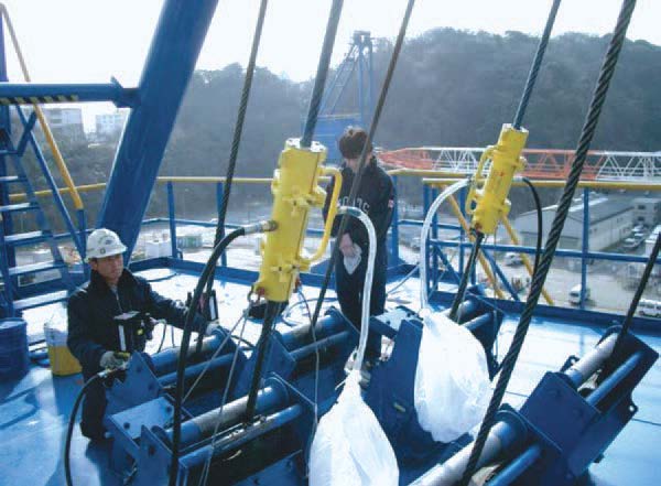 Yokosuka Naval Base Base. Twin SU35B Wire Rope Lubricators used on barge crane.